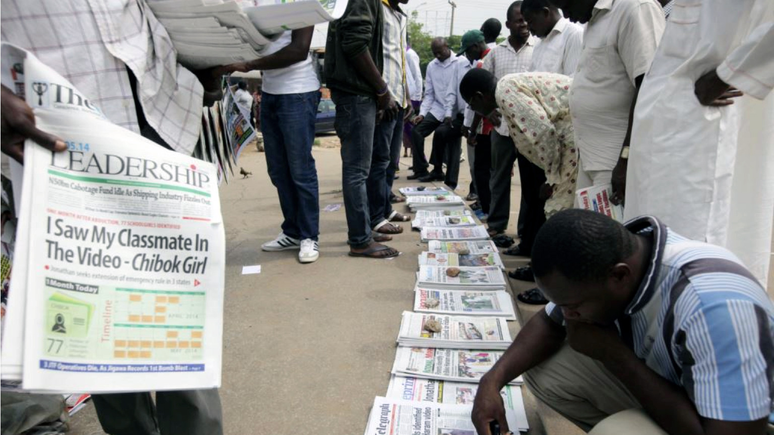 In some African countries, it’s not unusual to see crowds reading newspapers that have been laid out on sidewalks.